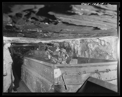 Untitled photo, possibly related to: Pittsburgh, Pennsylvania (vicinity). Montour no. 4 mine of the Pittsburgh Coal Company. Mechanical loader filling "trip" with coal.