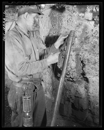 Untitled photo, possibly related to: Pittsburgh, Pennsylvania (vicinity). Montour no. 4 mine of the Pittsburgh Coal Company. Wiring a Cordox shell before blasting.