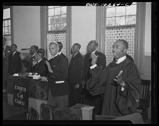 Washington, D.C. Elder Kelsey, at the far right, leading his deacons in song at the Church of God in Christ