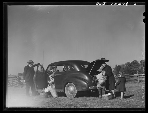 Untitled photo, possibly related to: Montgomery County, Maryland. Farmers sharing a car on market day
