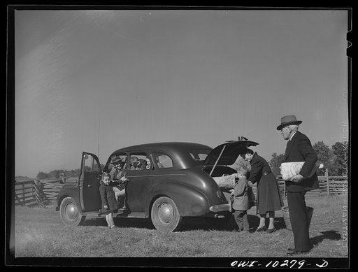 Untitled photo, possibly related to: Montgomery County, Maryland. Farmers sharing a car on market day