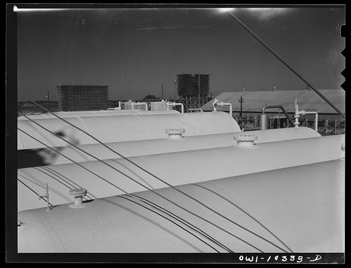Untitled photo, possibly related to: Tank cars at a gasoline plant loading rack