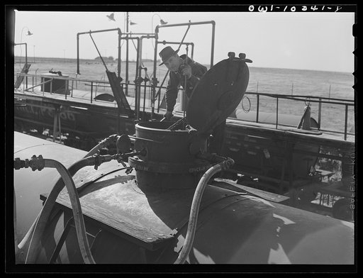 Untitled photo, possibly related to: Tank cars at a gasoline plant loading rack