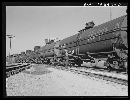 Inserting a placard in a tank car loaded with aviation fuel