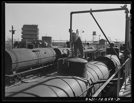 Untitled photo, possibly related to: Loading tank cars with aviation fuel at a gasoline plant
