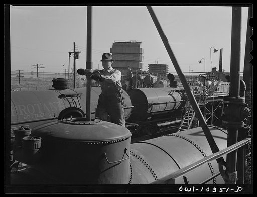 Untitled photo, possibly related to: Loading tank cars with aviation fuel at a gasoline plant