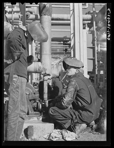 Untitled photo, possibly related to: Welders employed at a gasoline plant