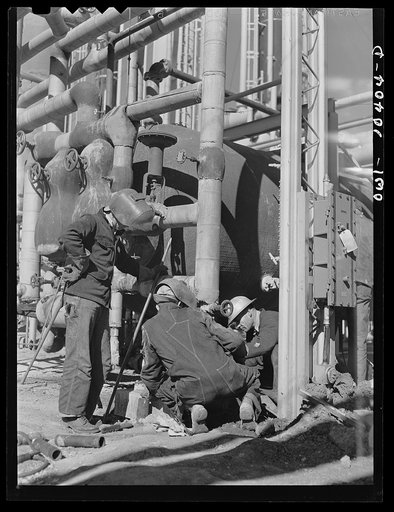Untitled photo, possibly related to: Welders employed at a gasoline plant