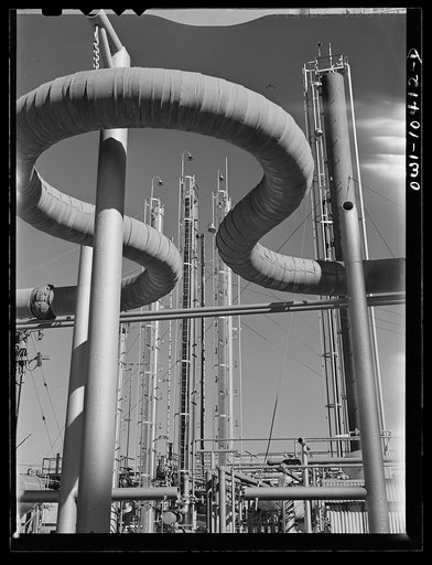 Pipeline and fractionating towers at a gasoline plant