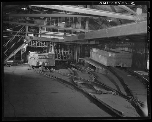 Pittsburgh, Pennsylvania (vicinity). Montour no. 4 mine of the Pittsburgh Coal Company. Interior of a tipple where loaded coal cars are raised from the floor of the mine in an elevator called the "cage", then by means of a rotary dump the coal is emptied into railroad cars directly beneath
