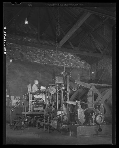 Untitled photo, possibly related to: Pittsburgh, Pennsylvania (vicinity). Montour no. 4 mine of the Pittsburgh Coal Company. Electrically driven hoist which lifts the cages of coal cars from the floor of the mine to the tipple where a rotary dump empties them into waiting railroad cars