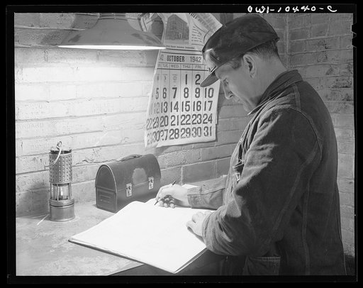 Pittsburgh, Pennsylvania (vicinity). Montour no. 4 mine of the Pittsburgh Coal Company. Fire boss signing the record which shows that he has inspected all working places in his section, before the entry of the men and once after work has started