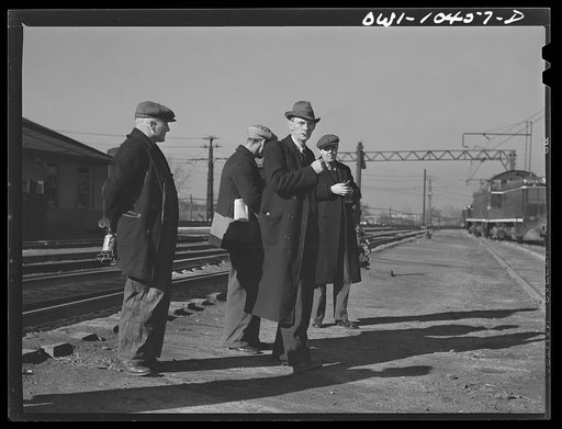 Chicago, Illinois. Men arriving for work at an Illinois Central Railroad yard