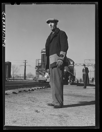 Chicago, Illinois. Brakeman waiting to hop an engine at an Illinois Central Railroad yard