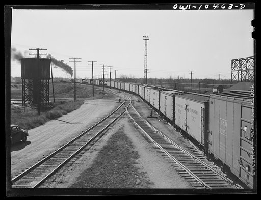 Chicago, Illinois. A train bound for New Orleans leaving an Illinois Central Railroad yard
