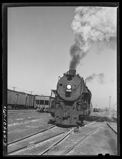 Untitled photo, possibly related to: Chicago, Illinois. An oil train from the Southwest leaves an Illinois Central Railroad yard for the Pennsylvania railroad to be sent on to the east
