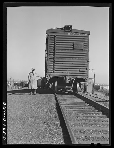 Chicago, Illinois. Car coming up over the south hump at an Illinois Central Railroad yard