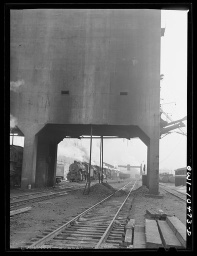Untitled photo, possibly related to: Chicago, Illinois. An oil train from the Southwest leaves an Illinois Central Railroad yard for the Pennsylvania railroad to be sent on to the east