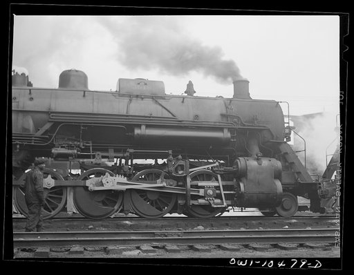 Untitled photo, possibly related to: Chicago, Illinois. An oil train from the Southwest leaves an Illinois Central Railroad yard for the Pennsylvania railroad to be sent on to the east