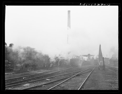Untitled photo, possibly related to: Chicago, Illinois. An oil train from the Southwest leaves an Illinois Central Railroad yard for the Pennsylvania railroad to be sent on to the east