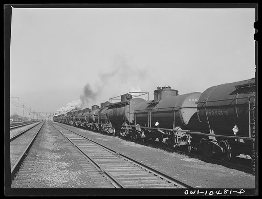 Chicago, Illinois. An oil train from the Southwest leaves an Illinois Central Railroad yard for the Pennsylvania railroad to be sent on to the east