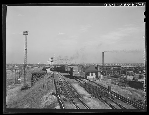Chicago, Illinois. General view of the south hump at an Illinois Central Railroad yard. To the right of the tracks is the scale house where the cars are weighed as they pass by
