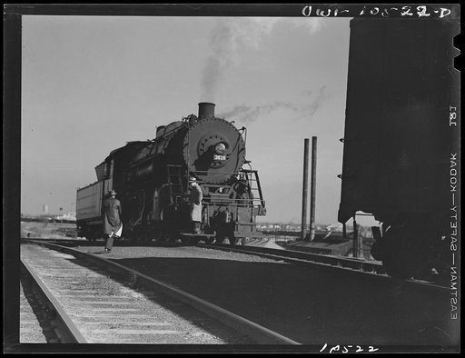 Untitled photo, possibly related to: Chicago, Illinois. Switch engine which has just pushed its last car over the hump at an Illinois Central Railroad yard
