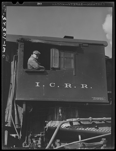 Untitled photo, possibly related to: Chicago, Illinois. Switch engine which has just pushed its last car over the hump at an Illinois Central Railroad yard