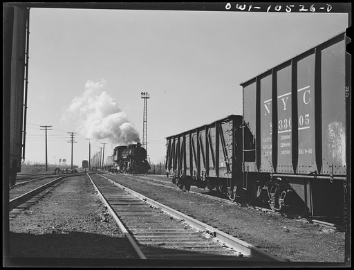 Untitled photo, possibly related to: Chicago, Illinois. Switch engine which has just pushed its last car over the hump at an Illinois Central Railroad yard