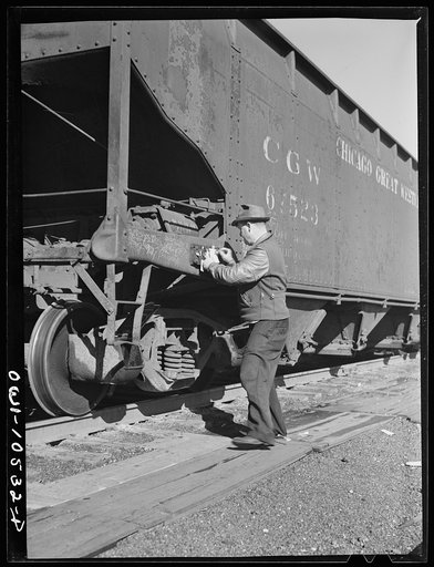 Chicago, Illinois. Train clerk marking cars as they go over the hump at an Illinois Central Railroad yard