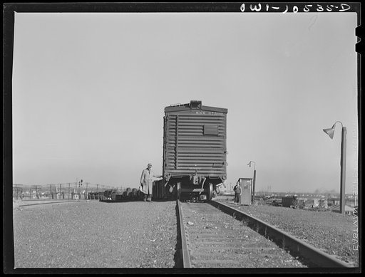 Untitled photo, possibly related to: Chicago, Illinois. Cars going over the south hump at an Illinois Central Railroad yard