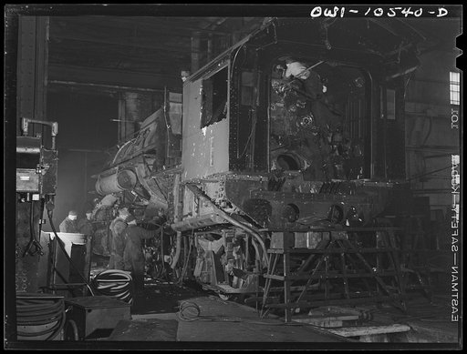 Chicago, Illinois. Locomotive repair in roundhouse at an Illinois Central Railroad yard