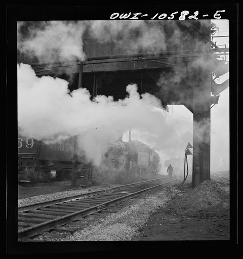 Chicago, Illinois. Locomotives loading up with coal, water, and sand at an Illinois Central Railroad yard before going out on the road