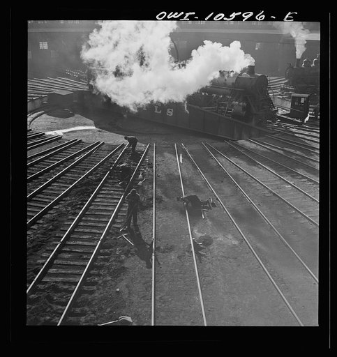Untitled photo, possibly related to: Chicago, Illinois. Track crews repairing tracks in the roundhouse at an Illinois railroad yard