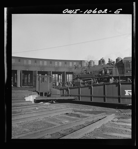 Untitled photo, possibly related to: Chicago, Illinois. Track crews repairing tracks in the roundhouse at an Illinois railroad yard