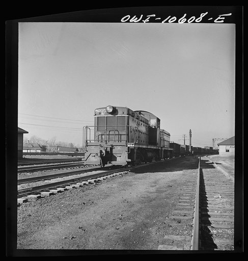 Chicago, Illinois. One of the giant diesel-electric locomotives at work at an Illinois Central Railroad yard