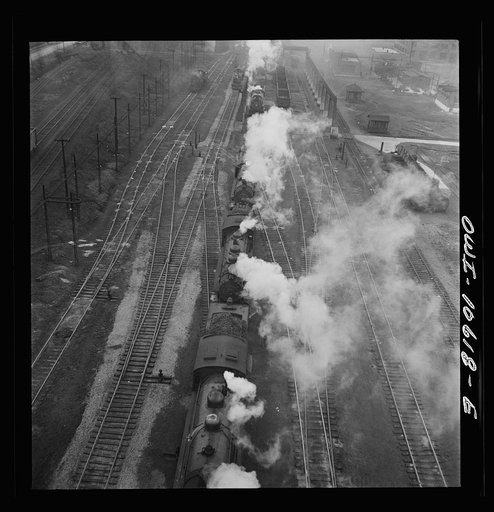 Untitled photo, possibly related to: Chicago, Illinois. Engines lined up at coaling station at an Illinois Central Railroad yard