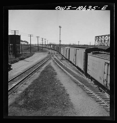 Untitled photo, possibly related to: Chicago, Illinois. Freight train bound for New Orleans leaving an Illinois Central railroad yard