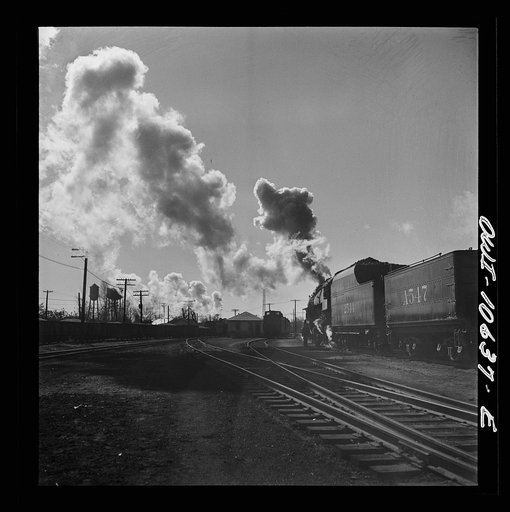 Untitled photo, possibly related to: Chicago, Illinois. Southbound freight train leaving an Illinois Central Railroad yard