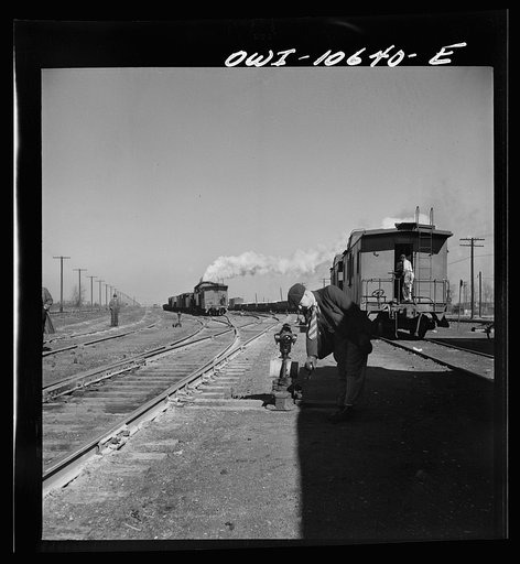 Untitled photo, possibly related to: Chicago, Illinois. Southbound freight train leaving an Illinois Central Railroad yard