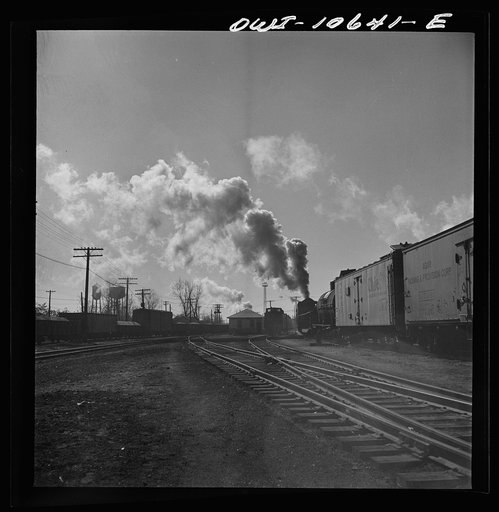 Chicago, Illinois. Southbound freight train leaving an Illinois Central Railroad yard