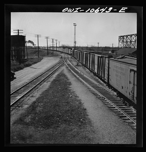 Chicago, Illinois. Freight train bound for New Orleans leaving an Illinois Central railroad yard