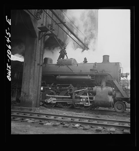 Untitled photo, possibly related to: Chicago, Illinois. Engines lined up at coaling station at an Illinois Central Railroad yard