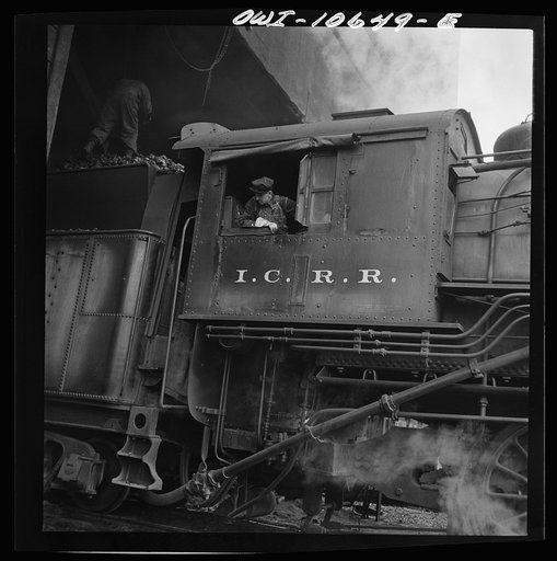 Chicago, Illinois. Engine taking on coal at an Illinois Central Railroad yard