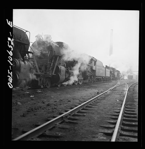 Untitled photo, possibly related to: Chicago, Illinois. Engines lined up at coaling station at an Illinois Central Railroad yard