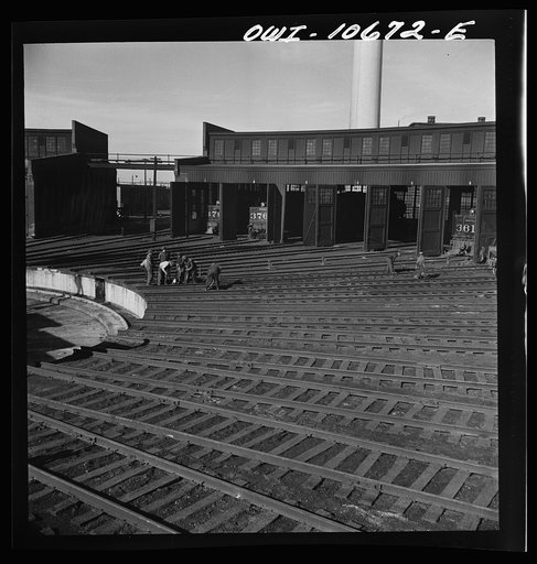 Chicago, Illinois. Truck crew working on the tracks at the roundhouse of an Illinois Central Railroad yard