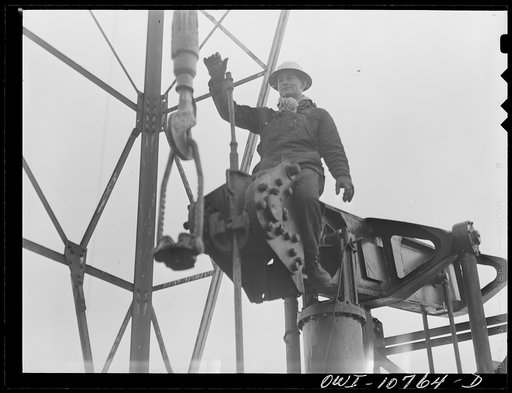 Oklahoma City, Oklahoma. Repairing a pump on an oil well