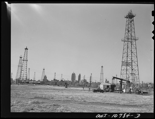 Oklahoma City, Oklahoma. Oil field discovered about 1930. All the wells are now on the pump