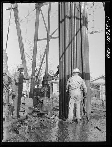 Untitled photo, possibly related to: Oklahoma City, Oklahoma. Tubing and rods removed from an oil well for repairing