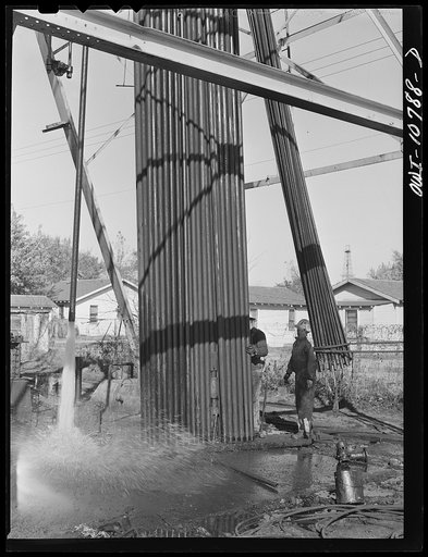 Oklahoma City, Oklahoma. Tubing and rods removed from an oil well for repairing